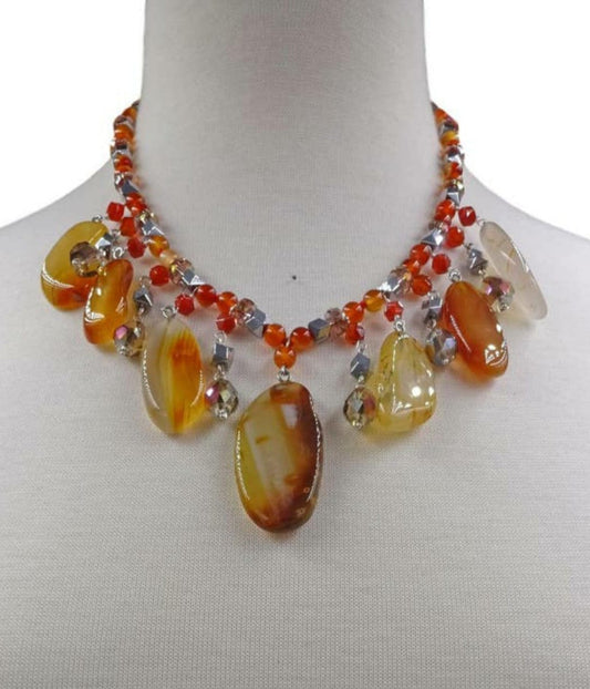 Chunky Agate Necklace featuring vibrant orange carnelian beads crafted into a bold statement crystal choker. This handmade brown jewelry piece combines earthy tones with striking gemstone energy, perfect for women who love unique, artisanal accessories. Lightweight yet eye-catching, it adds warmth and sophistication to any outfit. Ideal as a delicate gift for women who appreciate handcrafted jewelry that blends natural beauty with modern boho style and meaningful crystal healing properties.