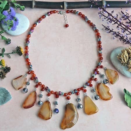 Chunky Agate Necklace featuring vibrant orange carnelian beads crafted into a bold statement crystal choker. This handmade brown jewelry piece combines earthy tones with striking gemstone energy, perfect for women who love unique, artisanal accessories. Lightweight yet eye-catching, it adds warmth and sophistication to any outfit. Ideal as a delicate gift for women who appreciate handcrafted jewelry that blends natural beauty with modern boho style and meaningful crystal healing properties.