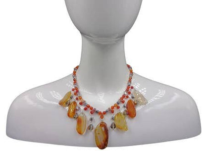 Chunky Agate Necklace featuring vibrant orange carnelian beads crafted into a bold statement crystal choker. This handmade brown jewelry piece combines earthy tones with striking gemstone energy, perfect for women who love unique, artisanal accessories. Lightweight yet eye-catching, it adds warmth and sophistication to any outfit. Ideal as a delicate gift for women who appreciate handcrafted jewelry that blends natural beauty with modern boho style and meaningful crystal healing properties.