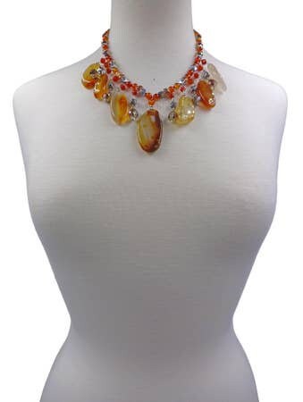 Chunky Agate Necklace featuring vibrant orange carnelian beads crafted into a bold statement crystal choker. This handmade brown jewelry piece combines earthy tones with striking gemstone energy, perfect for women who love unique, artisanal accessories. Lightweight yet eye-catching, it adds warmth and sophistication to any outfit. Ideal as a delicate gift for women who appreciate handcrafted jewelry that blends natural beauty with modern boho style and meaningful crystal healing properties.
