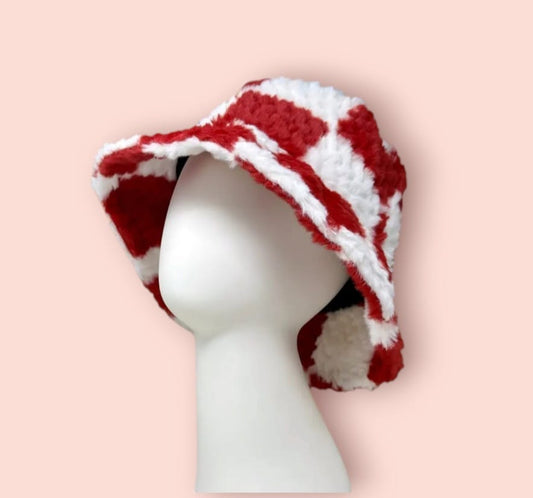 White and Red Checkered Crochet Bucket Hat with soft faux fur, handmade for cozy comfort and standout style during fall and winter. This warm and trendy unisex accessory features a bold checkered pattern and plush texture, perfect for casual wear, cold-weather outings, and fashion-forward looks. Designed for both men and women, it combines vintage crochet charm with modern flair—an ideal gift or statement piece for stylish, chilly-day layering.