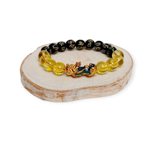 Citrine Obsidian Pixiu bracelet designed for wealth attraction and protection, handcrafted with natural crystals. This Feng Shui-inspired healing jewelry piece combines the powerful energy of citrine and obsidian stones, believed to enhance prosperity, ward off negative energy, and bring balance. Suitable for men and women, it makes a meaningful gift for those seeking spiritual harmony and positive energy in daily life.