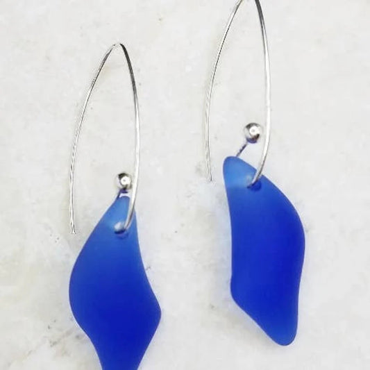 Sea Glass Earrings featuring vibrant cobalt blue pieces set in sterling silver, handcrafted into a unique splash design for women who love coastal-inspired jewelry. These elegant earrings blend ocean charm with artisan craftsmanship, making them perfect for holidays, beach outings, or everyday wear. Lightweight and eye-catching, they’re a thoughtful handmade gift for her, offering a bold pop of color and a touch of seaside beauty in every look.