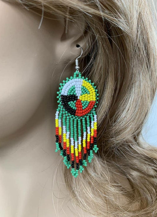 Native Style Colorful Beaded Earrings featuring a large sunburst dangle design with vibrant beads in bold boho ethnic patterns. These handmade festival fashion earrings add lively color and intricate artistry to any outfit. Perfect gift for women who appreciate unique, handcrafted jewelry with cultural significance. Lightweight and striking, ideal for festivals, casual wear, or special occasions. Celebrate artisan craftsmanship and bohemian style.