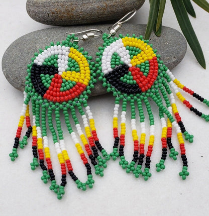 Native Style Colorful Beaded Earrings featuring a large sunburst dangle design with vibrant beads in bold boho ethnic patterns. These handmade festival fashion earrings add lively color and intricate artistry to any outfit. Perfect gift for women who appreciate unique, handcrafted jewelry with cultural significance. Lightweight and striking, ideal for festivals, casual wear, or special occasions. Celebrate artisan craftsmanship and bohemian style.