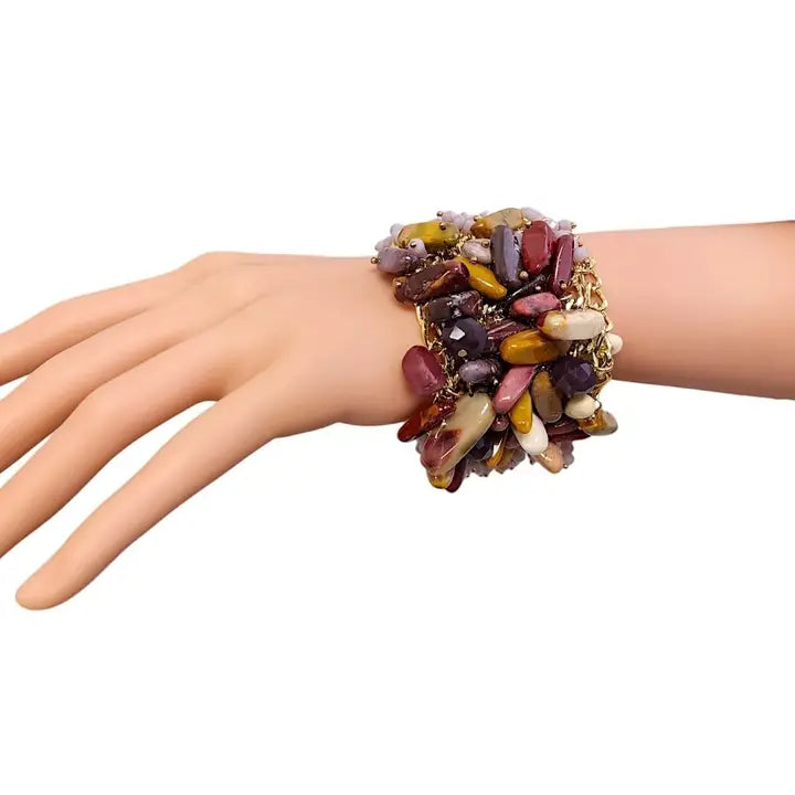 Stone fringe gold chain bracelet for women featuring dainty gemstones and a delicate boho design. Perfect for layering or wearing alone, this minimalist bracelet adds subtle elegance to any outfit. A thoughtful gift for her, it suits both casual and dressy occasions with its lightweight, stylish charm. Ideal for women who love dainty, nature-inspired jewelry, this piece blends bohemian beauty with modern simplicity for everyday wear.