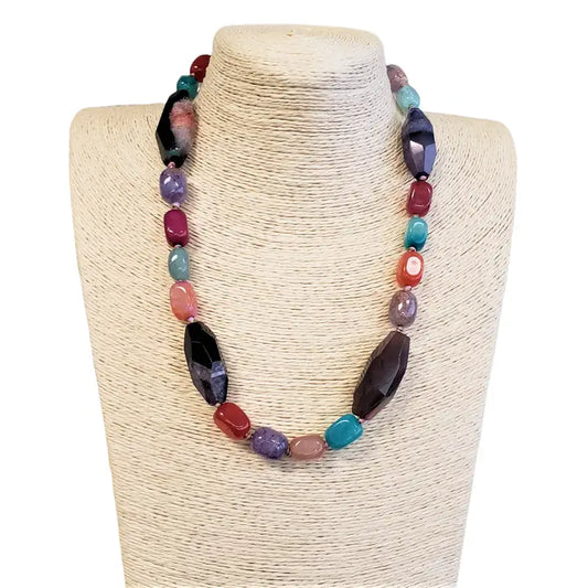 Faceted multi jewel tone agate stone necklace featuring mixed shape gemstones for a vibrant boho statement look. This colorful crystal jewelry piece combines rich hues and unique cuts, perfect for adding eye-catching sparkle to any outfit. Ideal as a gift for gemstone lovers, it complements casual and dressy styles alike. A versatile accessory that brings natural beauty and bold color to your jewelry collection