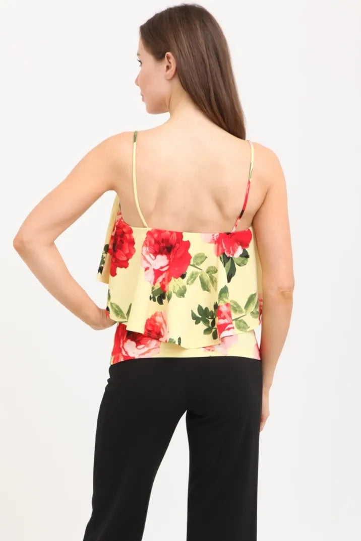 Strap ruffle flower print top for women made from soft knit fabric, featuring delicate floral details and lightweight construction. This summer blouse is designed for casual wear, offering comfort and breathability during warm weather. Made in the USA, it combines feminine ruffle straps with a vibrant flower print for a stylish and versatile outfit option perfect for everyday use or casual outings.