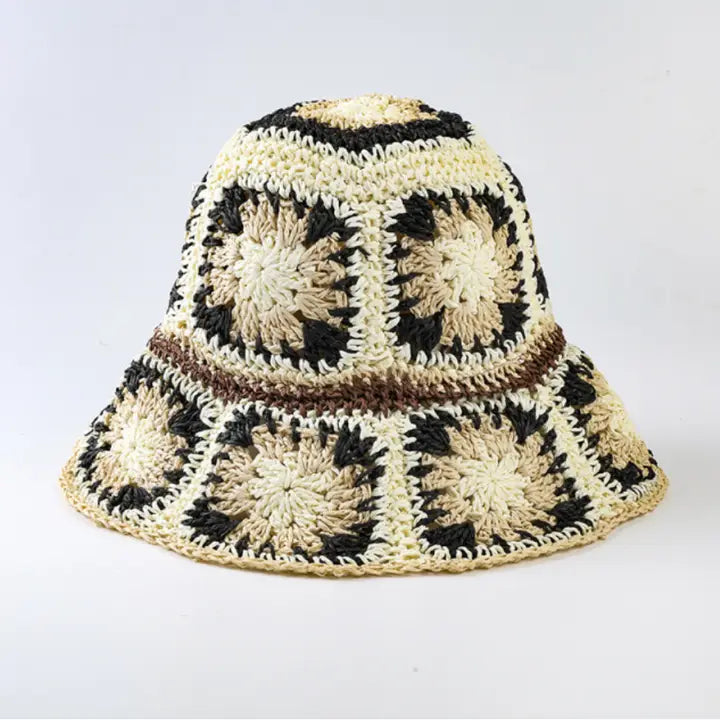 Foldable black crochet bucket hat with wide brim, perfect for summer sun protection and beach outings. This lightweight fisherman-style hat is designed for women who love stylish yet practical travel accessories. Handmade with breathable material, it’s easy to fold and carry, making it an ideal summer accessory for outdoor adventures, vacations, or casual everyday wear with a chic cottage-inspired look.
