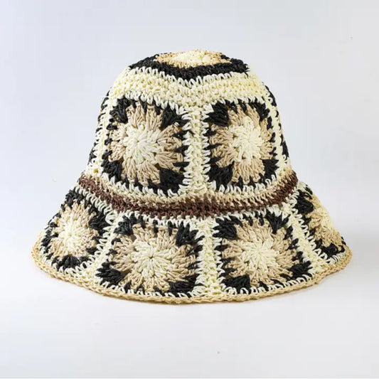 Foldable black crochet bucket hat with wide brim, perfect for summer sun protection and beach outings. This lightweight fisherman-style hat is designed for women who love stylish yet practical travel accessories. Handmade with breathable material, it’s easy to fold and carry, making it an ideal summer accessory for outdoor adventures, vacations, or casual everyday wear with a chic cottage-inspired look.