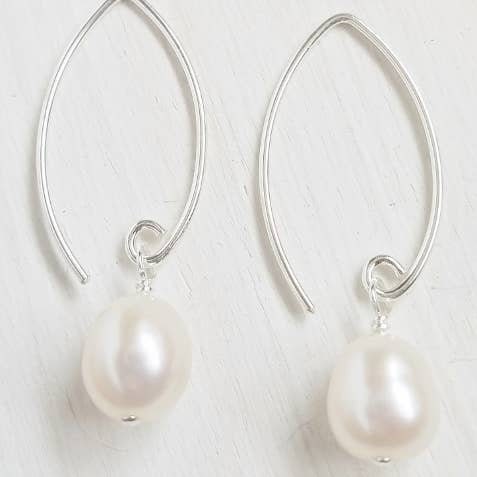 Genuine Freshwater Pearl Earrings set in white sterling silver, featuring elegant and dainty design perfect for women seeking classic jewelry. These timeless earrings add sophistication and subtle shine to any outfit, ideal for weddings, formal events, or everyday wear. A perfect gift for her, combining natural pearl beauty with durable craftsmanship. Stylish and versatile, they elevate both casual and dressy looks with effortless grace.