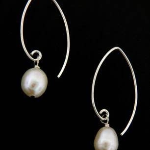 Genuine Freshwater Pearl Earrings set in white sterling silver, featuring elegant and dainty design perfect for women seeking classic jewelry. These timeless earrings add sophistication and subtle shine to any outfit, ideal for weddings, formal events, or everyday wear. A perfect gift for her, combining natural pearl beauty with durable craftsmanship. Stylish and versatile, they elevate both casual and dressy looks with effortless grace.Pearl Sterling Silver Earrings