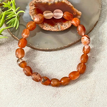 Genuine Red Jade Stretch Bracelet for Women featuring natural red jade beads, handmade with care for durability and comfort. This elegant beaded bracelet is perfect as a healing crystal jewelry piece, known for promoting vitality, courage, and emotional balance. A thoughtful gift for her, ideal for birthdays, anniversaries, or spiritual occasions. Stylish energy bracelet that combines wellness and fashion effortlessly.