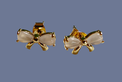 Gold-plated ribbon bow stud earrings featuring a delicate bow design with a polished, elegant finish for a feminine and timeless look. These lightweight stud earrings are perfect for everyday wear or special occasions, adding a subtle touch of charm and sparkle to any outfit. A thoughtful jewelry gift for women, teens, or bridesmaids, ideal for birthdays, holidays, weddings, or stylish minimal accessories lovers.