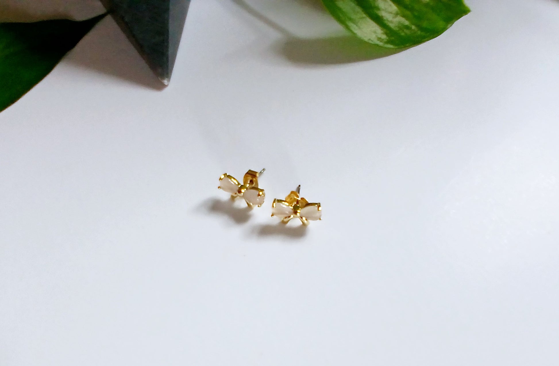 Gold-plated ribbon bow stud earrings featuring a delicate bow design with a polished, elegant finish for a feminine and timeless look. These lightweight stud earrings are perfect for everyday wear or special occasions, adding a subtle touch of charm and sparkle to any outfit. A thoughtful jewelry gift for women, teens, or bridesmaids, ideal for birthdays, holidays, weddings, or stylish minimal accessories lovers.