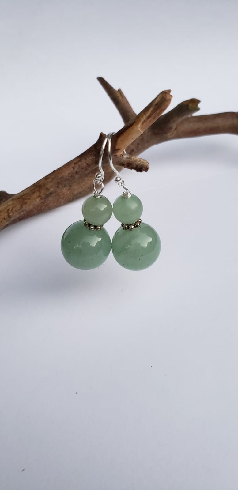 Green Aventurine Jade Earrings featuring 8-12mm natural stones set in sterling silver dangle style, perfect for boho-inspired jewelry lovers. These exotic green earrings add vibrant color and natural elegance to any outfit. Handmade with genuine stones, they offer healing properties and a unique aesthetic. Ideal as a thoughtful gift for her, suitable for casual wear, special occasions, or festival fashion. Stylish, earthy, and timeless.