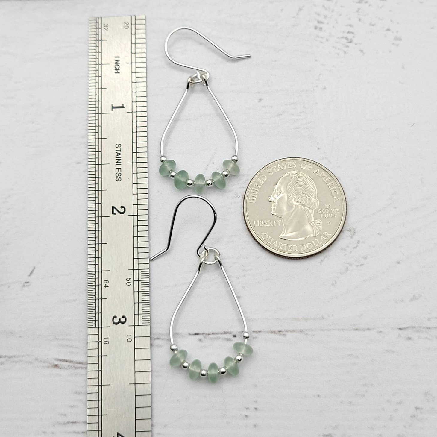 Green Crystal Sterling Silver Earrings featuring handmade dangle design with sea glass hoops, perfect for women who love unique statement jewelry. These artisanal earrings combine vibrant green crystals with delicate sterling silver craftsmanship, creating a stylish and eye-catching accessory. Ideal as a gift for her, they add a touch of natural elegance and boho flair to any outfit. Lightweight and versatile, these earrings are perfect for festivals, casual wear, or special occasions.