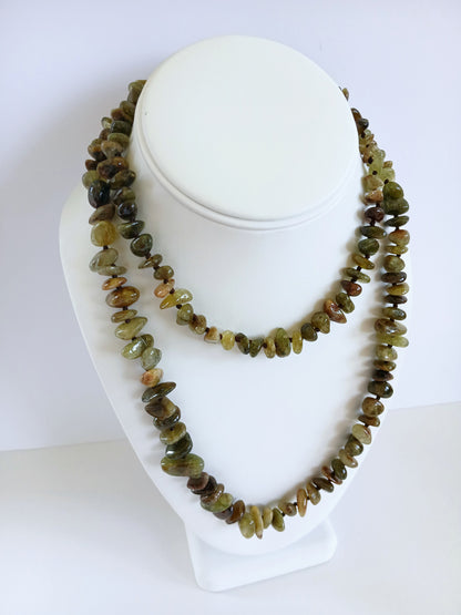 Natural Green Garnet Long Necklace for Women featuring double strands of vibrant green garnet gemstones, expertly handcrafted for elegance and durability. This stunning gemstone jewelry piece is secured with a sterling silver clasp, symbolizing abundance and prosperity. Perfect for adding a touch of natural beauty and positive energy to any outfit, making it an ideal gift for her on birthdays, anniversaries, or special occasions.