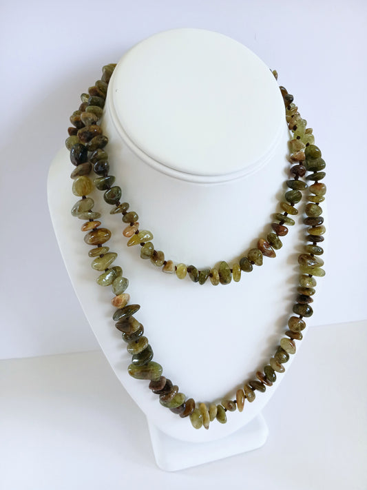 Natural Green Garnet Long Necklace for Women featuring double strands of vibrant green garnet gemstones, expertly handcrafted for elegance and durability. This stunning gemstone jewelry piece is secured with a sterling silver clasp, symbolizing abundance and prosperity. Perfect for adding a touch of natural beauty and positive energy to any outfit, making it an ideal gift for her on birthdays, anniversaries, or special occasions.