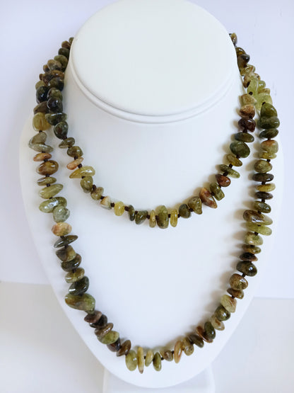 Natural Green Garnet Long Necklace for Women featuring double strands of vibrant green garnet gemstones, expertly handcrafted for elegance and durability. This stunning gemstone jewelry piece is secured with a sterling silver clasp, symbolizing abundance and prosperity. Perfect for adding a touch of natural beauty and positive energy to any outfit, making it an ideal gift for her on birthdays, anniversaries, or special occasions.
