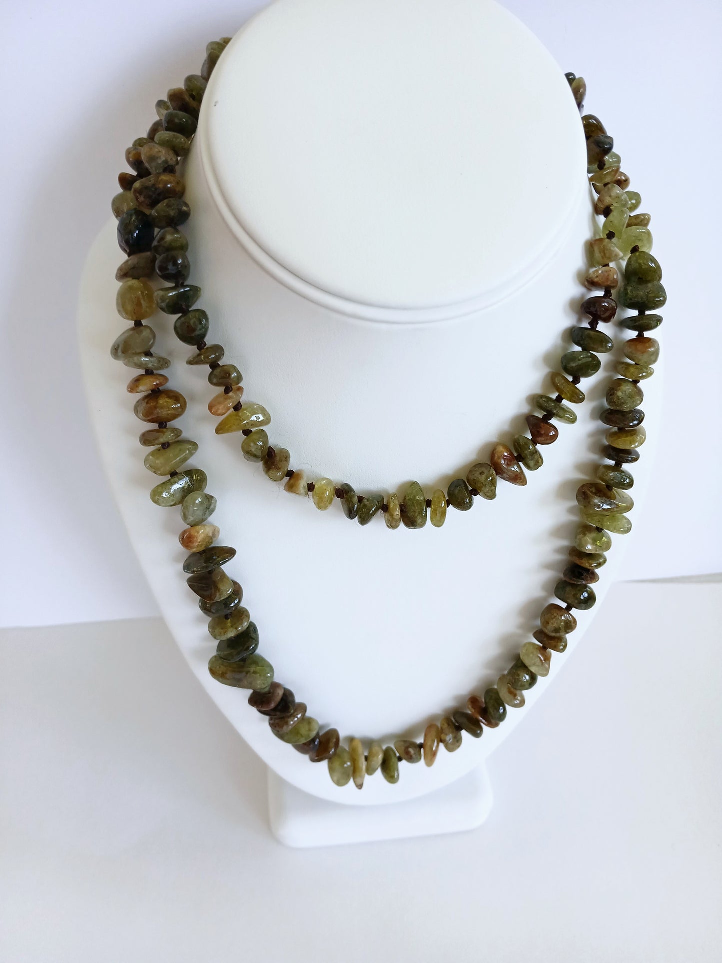 Natural Green Garnet Long Necklace for Women featuring double strands of vibrant green garnet gemstones, expertly handcrafted for elegance and durability. This stunning gemstone jewelry piece is secured with a sterling silver clasp, symbolizing abundance and prosperity. Perfect for adding a touch of natural beauty and positive energy to any outfit, making it an ideal gift for her on birthdays, anniversaries, or special occasions.