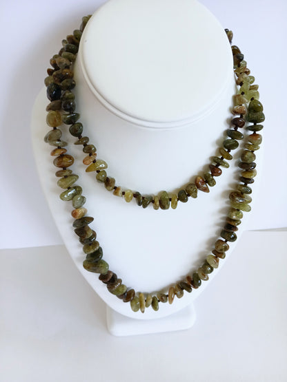 Natural Green Garnet Long Necklace for Women featuring double strands of vibrant green garnet gemstones, expertly handcrafted for elegance and durability. This stunning gemstone jewelry piece is secured with a sterling silver clasp, symbolizing abundance and prosperity. Perfect for adding a touch of natural beauty and positive energy to any outfit, making it an ideal gift for her on birthdays, anniversaries, or special occasions.