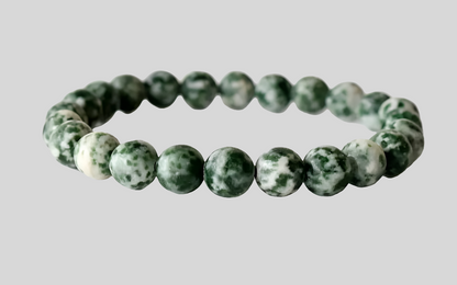 Green Spot Jasper Healing Bracelet featuring natural stone beads crafted to promote energy balance, meditation, and chakra healing for women. This handcrafted crystal jewelry combines the soothing green hues of spot jasper with artisanal beadwork, offering both spiritual benefits and stylish wearability. Ideal for those seeking calming energy and wellness, this bracelet serves as a meaningful accessory for everyday use or mindful practices, blending beauty with holistic healing properties.