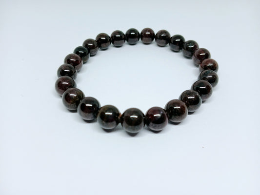 Garnet Handmade Bracelet featuring natural deep red crystal beads crafted into a healing energy design for women and men. This unisex gemstone bracelet promotes strength, passion, and energy balance, making it a meaningful gift for her or him. Perfect for daily wear, meditation, or spiritual wellness, it blends natural beauty with artisan craftsmanship. Lightweight and powerful, this bracelet adds a bold touch to any outfit while supporting emotional and physical grounding.