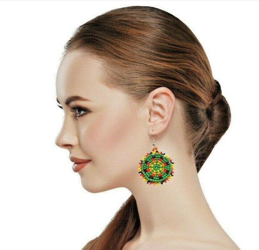 Green Handmade Beaded Earrings for women featuring intricate native-style beadwork in a bold boho design. These statement green medallion earrings showcase vibrant beads arranged in festival-inspired patterns, perfect for adding color and artistry to any outfit. Ideal gift for women who love unique, handcrafted jewelry with cultural flair. Lightweight and eye-catching, these earrings complement casual and dressy looks alike, making them perfect for festivals or everyday wear.