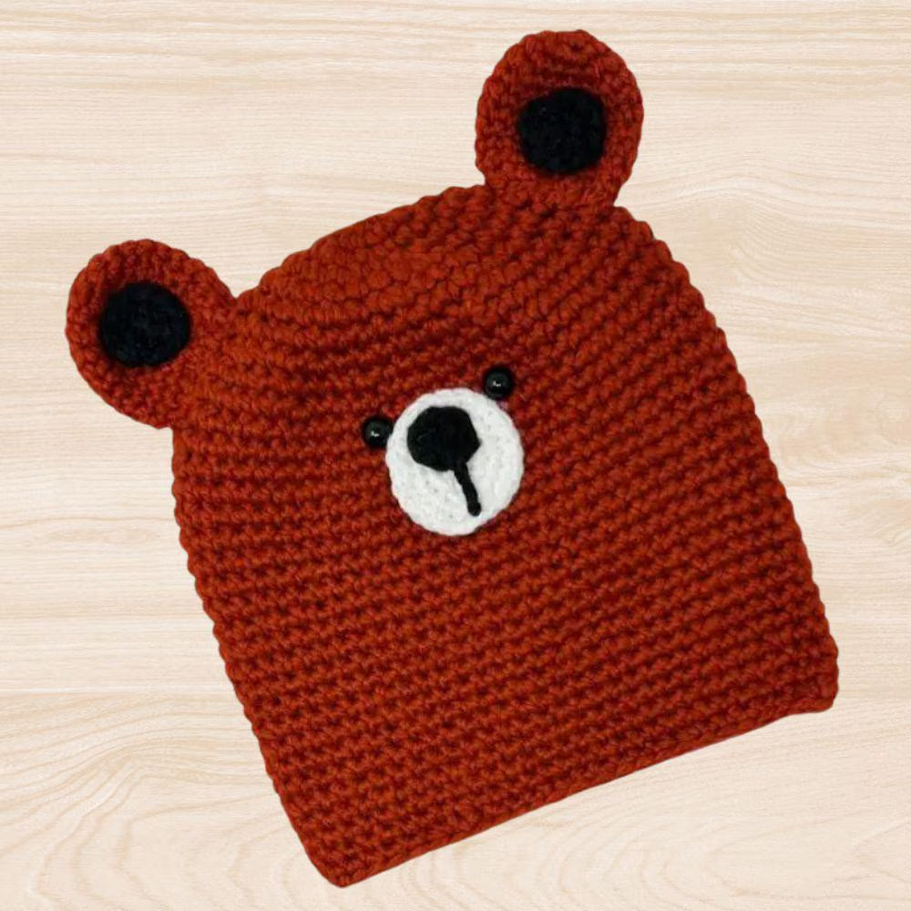 Handmade honey bear crochet hat designed for kids and adults, offering cozy warmth for fall, winter, and spring. This fun unisex beanie features adorable bear ears and a soft, comfortable fit, making it a charming accessory for all ages. Perfect as a thoughtful gift, it blends playful style with handmade quality. Ideal for everyday wear or special occasions, this crochet hat adds a touch of whimsy and warmth to any cool-weather outfit.