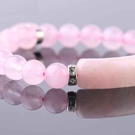 Rose Quartz Love Bracelet for women featuring delicate pink crystal beads handcrafted into a beautiful healing stone bracelet. This handmade jewelry piece symbolizes love, compassion, and emotional healing, making it a meaningful good luck gift for her. Perfect for everyday wear or special occasions, it combines gentle elegance with spiritual benefits. Ideal for those seeking a stylish accessory that promotes positivity, self-love, and heartfelt connections through natural rose quartz energy.