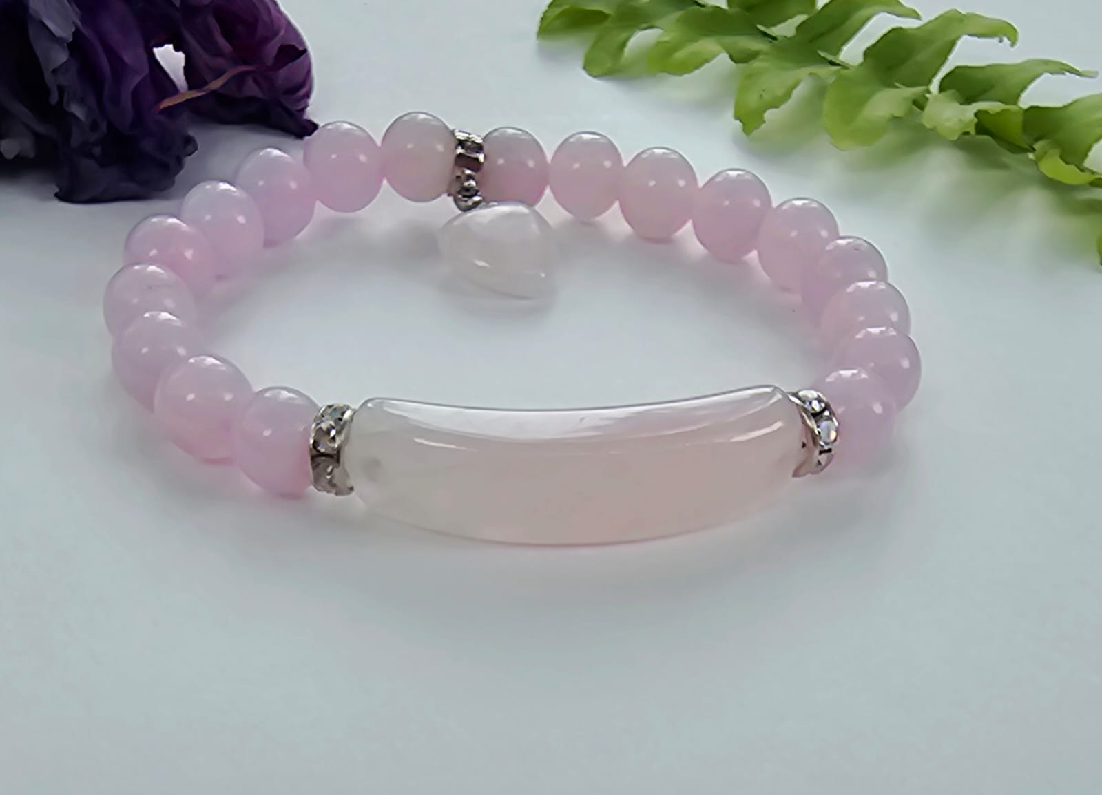 Rose Quartz Love Bracelet for women featuring delicate pink crystal beads handcrafted into a beautiful healing stone bracelet. This handmade jewelry piece symbolizes love, compassion, and emotional healing, making it a meaningful good luck gift for her. Perfect for everyday wear or special occasions, it combines gentle elegance with spiritual benefits. Ideal for those seeking a stylish accessory that promotes positivity, self-love, and heartfelt connections through natural rose quartz energy.