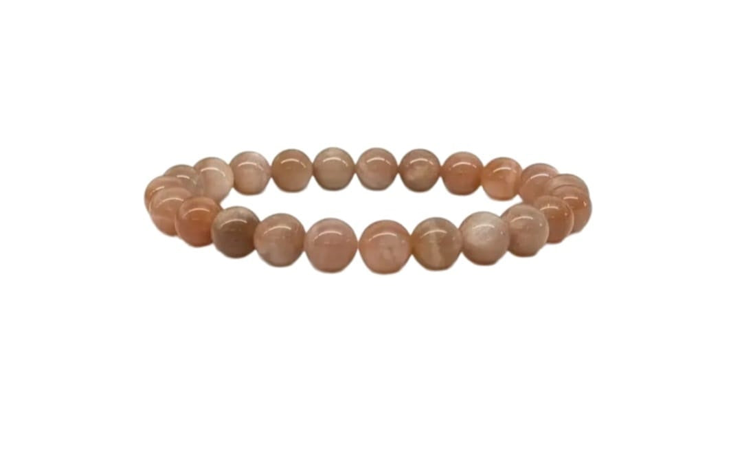 Genuine Sunstone Nugget Stretch Bracelet featuring handmade crystal beads designed for women who appreciate natural healing gemstone jewelry. This artisanal sunstone bracelet showcases radiant orange hues symbolizing positivity and energy. Lightweight and comfortable, it makes a thoughtful gift for her, perfect for spiritual wellness or everyday wear. Combining vibrant sunstone nuggets with stretchy design, this bracelet blends style, healing properties, and handcrafted elegance.