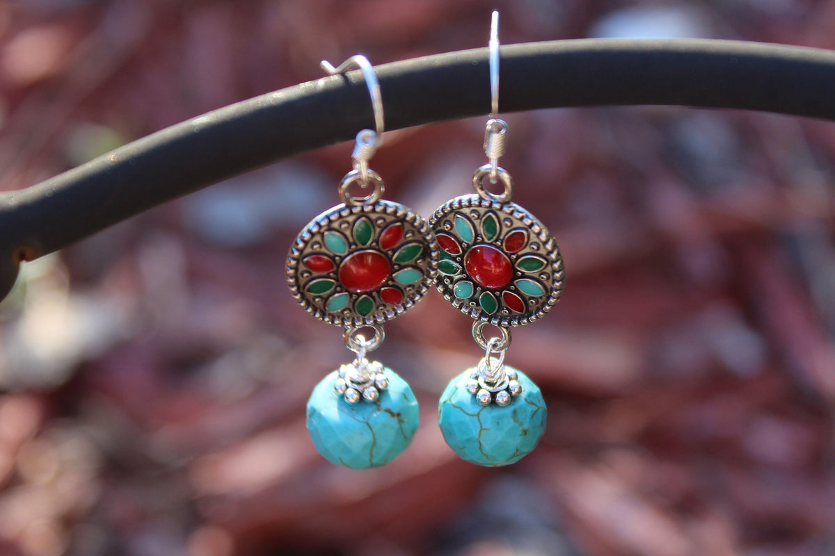 Turquoise Earrings featuring a Southwestern style with vibrant blue stones in a bold, handmade design inspired by Tibetan and Aztec jewelry. These boho statement earrings are perfect for women who love cultural patterns and earthy elegance. Lightweight and eye-catching, they make a meaningful gift for her on birthdays, holidays, or special occasions. A unique accessory that adds rustic charm and artisan style to any outfit.
