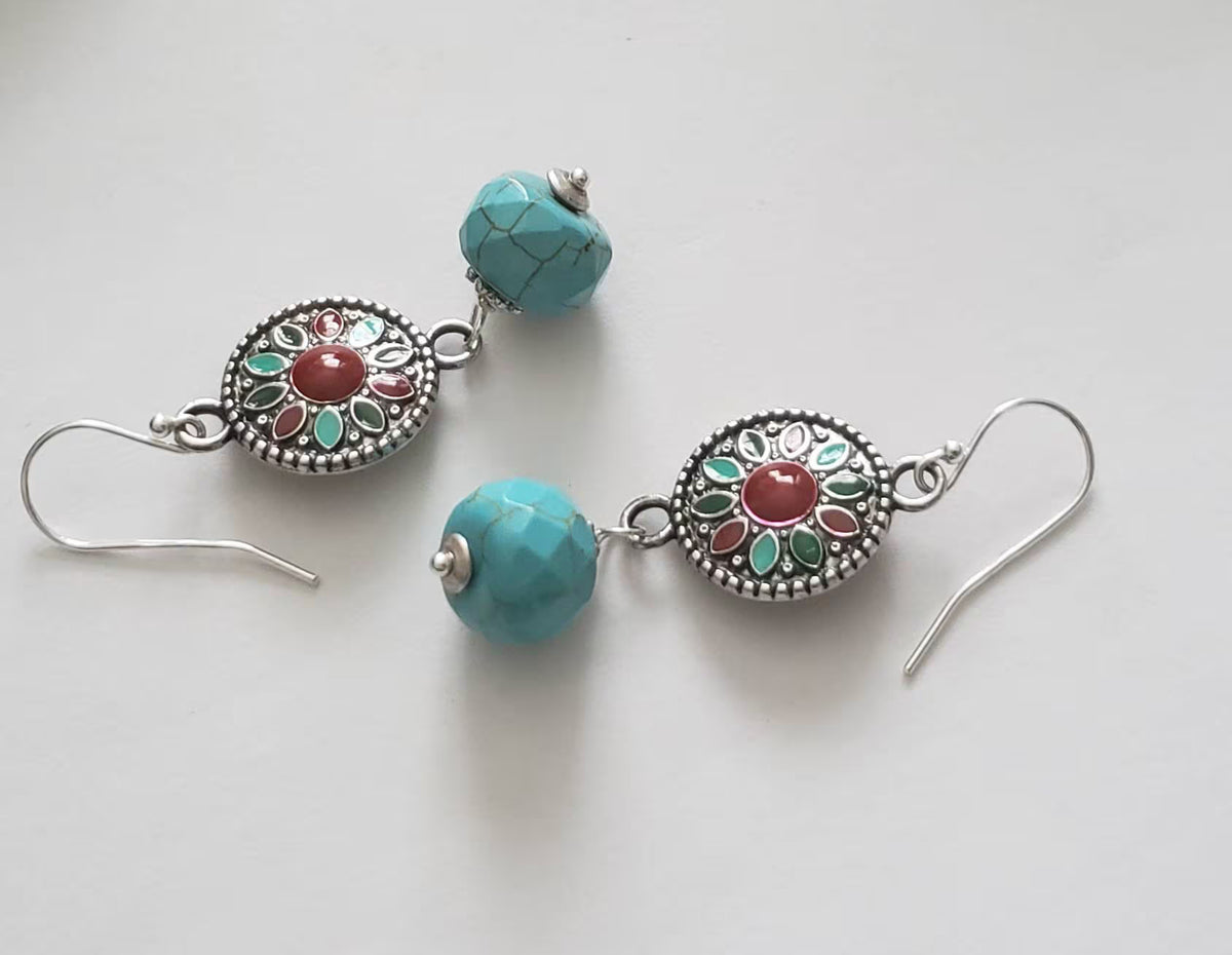 Turquoise Earrings featuring a Southwestern style with vibrant blue stones in a bold, handmade design inspired by Tibetan and Aztec jewelry. These boho statement earrings are perfect for women who love cultural patterns and earthy elegance. Lightweight and eye-catching, they make a meaningful gift for her on birthdays, holidays, or special occasions. A unique accessory that adds rustic charm and artisan style to any outfit.