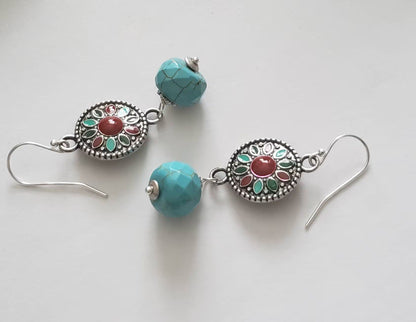 Turquoise Earrings featuring a Southwestern style with vibrant blue stones in a bold, handmade design inspired by Tibetan and Aztec jewelry. These boho statement earrings are perfect for women who love cultural patterns and earthy elegance. Lightweight and eye-catching, they make a meaningful gift for her on birthdays, holidays, or special occasions. A unique accessory that adds rustic charm and artisan style to any outfit.