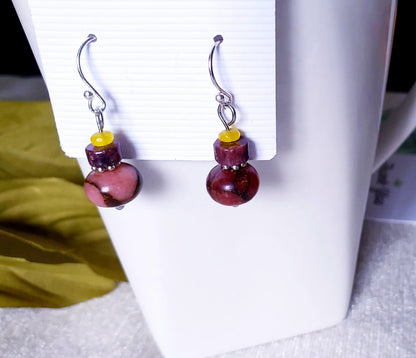 Jade Earrings featuring sterling silver settings with brown and pink jade stones, handcrafted for women. These elegant earrings are perfect for bridesmaids, bridal parties, or as a stylish fashion gift for her. The unique combination of earthy tones and delicate craftsmanship creates a timeless accessory ideal for weddings, special occasions, or everyday wear. Lightweight and graceful, these handmade earrings blend sophistication with natural beauty.