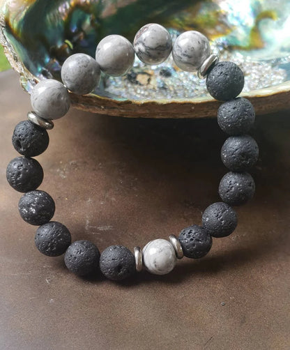 Jasper Lava Stone Diffuser Bracelet handcrafted for men, featuring natural jasper and porous lava stones perfect for essential oil diffusion. This chakra-inspired jewelry piece promotes balance, grounding, and positive energy while allowing personalized aromatherapy on the go. Adjustable and durable, it’s ideal for everyday wear, meditation, or mindfulness practices. A thoughtful gift for men who appreciate handmade jewelry, wellness accessories, and stylish, meaningful gemstone bracelets.