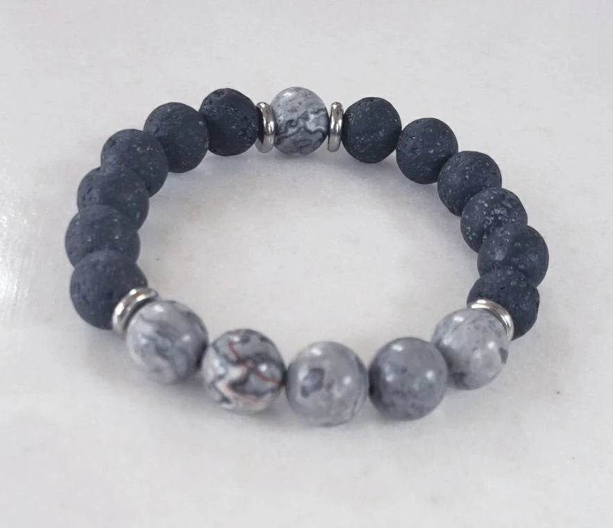 Jasper Lava Stone Diffuser Bracelet handcrafted for men, featuring natural jasper and porous lava stones perfect for essential oil diffusion. This chakra-inspired jewelry piece promotes balance, grounding, and positive energy while allowing personalized aromatherapy on the go. Adjustable and durable, it’s ideal for everyday wear, meditation, or mindfulness practices. A thoughtful gift for men who appreciate handmade jewelry, wellness accessories, and stylish, meaningful gemstone bracelets.