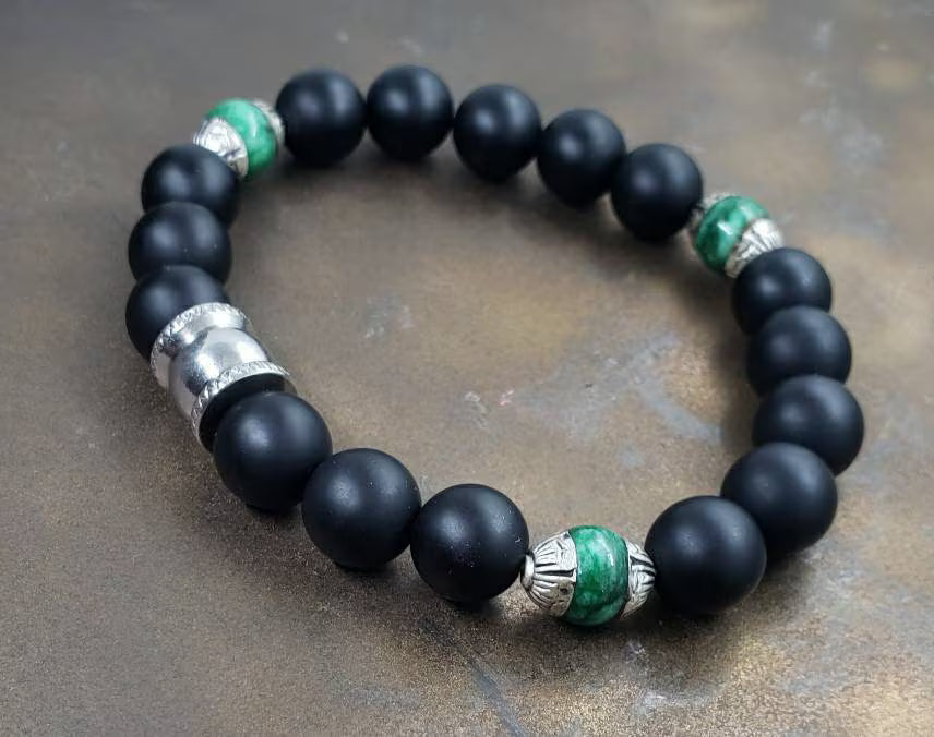 Natural Jade and Black Onyx Bracelet handcrafted as a men’s lucky charm and protection armband. This healing jewelry piece combines smooth jade and powerful black onyx stones, designed for strength, balance, and spiritual protection. Perfect handmade gift for him, ideal for birthdays, anniversaries, or wellness gifts. Stylish and meaningful, this men’s stretch bracelet blends natural energy with everyday wearable craftsmanship.