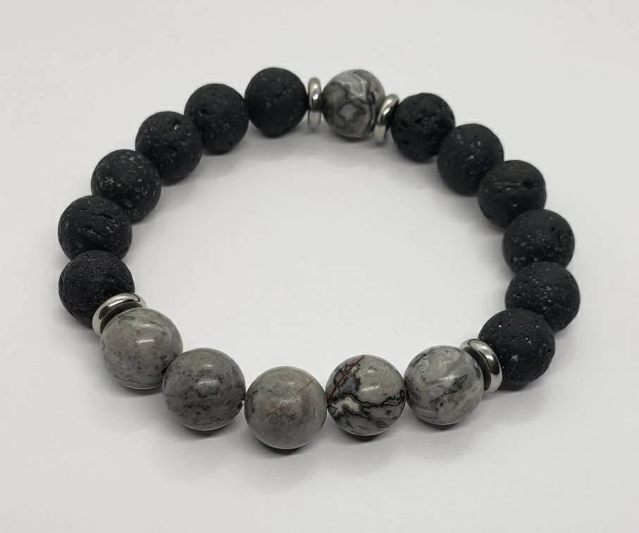 Jasper Lava Stone Diffuser Bracelet handcrafted for men, featuring natural jasper and porous lava stones perfect for essential oil diffusion. This chakra-inspired jewelry piece promotes balance, grounding, and positive energy while allowing personalized aromatherapy on the go. Adjustable and durable, it’s ideal for everyday wear, meditation, or mindfulness practices. A thoughtful gift for men who appreciate handmade jewelry, wellness accessories, and stylish, meaningful gemstone bracelets.