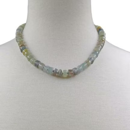 Green Emerald Gemstone Necklace featuring vibrant emerald and deep blue kyanite beads, handcrafted into a boho-inspired design with sterling silver accents. This elegant handmade necklace is perfect for women who appreciate unique, natural gemstone jewelry. Ideal gift for moms or special occasions, blending timeless style with spiritual energy. A stunning piece that complements both casual and formal looks, highlighting artisanal craftsmanship and meaningful stones.