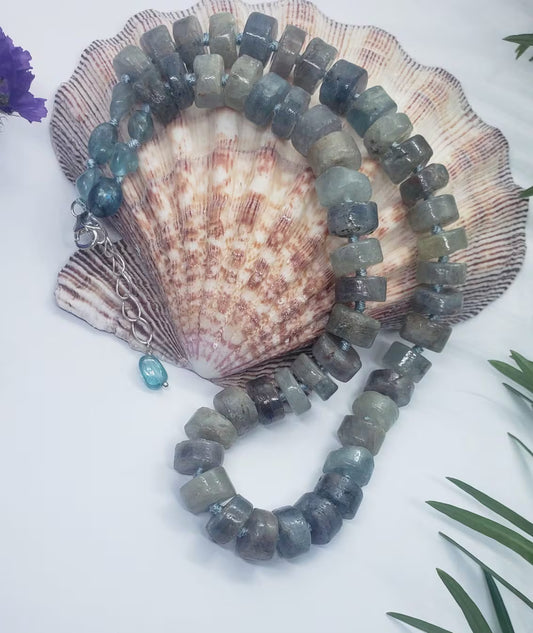 Green Emerald Gemstone Necklace featuring vibrant emerald and deep blue kyanite beads, handcrafted into a boho-inspired design with sterling silver accents. This elegant handmade necklace is perfect for women who appreciate unique, natural gemstone jewelry. Ideal gift for moms or special occasions, blending timeless style with spiritual energy. A stunning piece that complements both casual and formal looks, highlighting artisanal craftsmanship and meaningful stones.