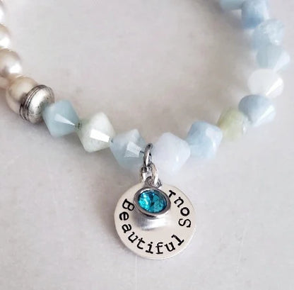 Aquamarine Pearl Bracelet featuring handmade beaded design combining soothing aquamarine stones with lustrous pearls. This inspirational jewelry piece is perfect as a March birthstone gift, symbolizing calmness, courage, and good luck. Ideal for her or as a thoughtful mother’s gift, it blends elegant style with meaningful healing properties. Lightweight and versatile, this bracelet adds a delicate, spiritual touch to everyday wear or special occasions, celebrating love and positive energy.