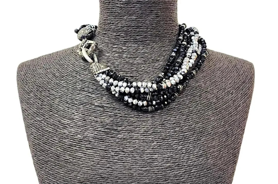 Bold chunky crystal statement necklace for women featuring multi-strand black design and handmade craftsmanship. This stylish choker adds a dramatic touch to any outfit, perfect for parties, events, or anniversary celebrations. Elegant and eye-catching, this costume jewelry piece is ideal as a unique gift for her. Designed to enhance confidence and style, this artisan necklace blends modern fashion with timeless sophistication.