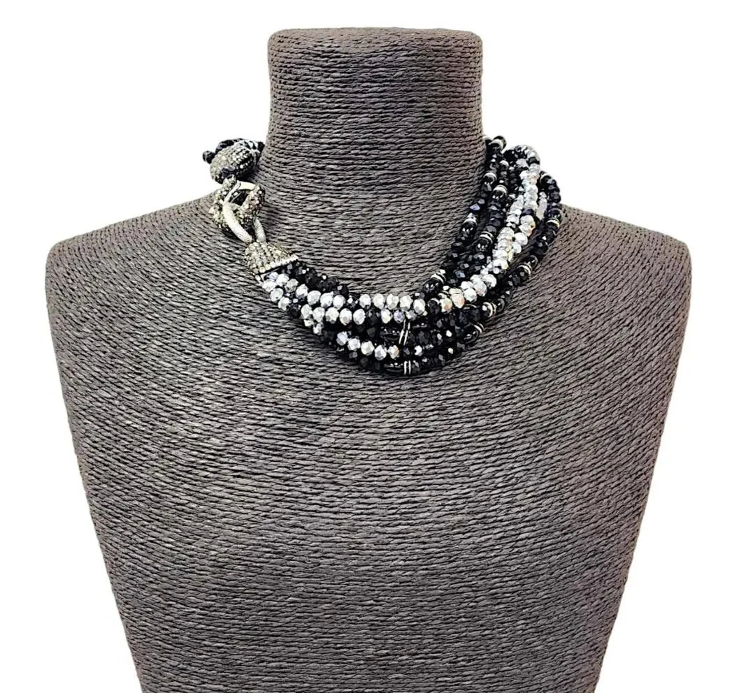 Bold chunky crystal statement necklace for women featuring multi-strand black design and handmade craftsmanship. This stylish choker adds a dramatic touch to any outfit, perfect for parties, events, or anniversary celebrations. Elegant and eye-catching, this costume jewelry piece is ideal as a unique gift for her. Designed to enhance confidence and style, this artisan necklace blends modern fashion with timeless sophistication.