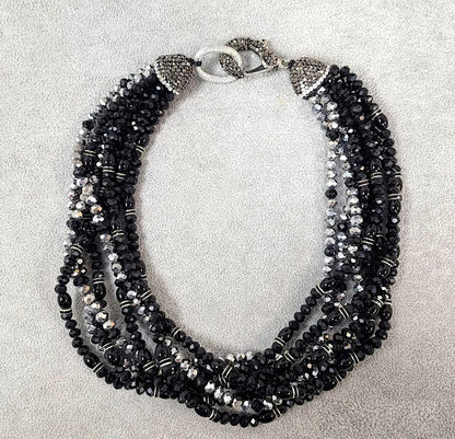 Bold chunky crystal statement necklace for women featuring multi-strand black design and handmade craftsmanship. This stylish choker adds a dramatic touch to any outfit, perfect for parties, events, or anniversary celebrations. Elegant and eye-catching, this costume jewelry piece is ideal as a unique gift for her. Designed to enhance confidence and style, this artisan necklace blends modern fashion with timeless sophistication.