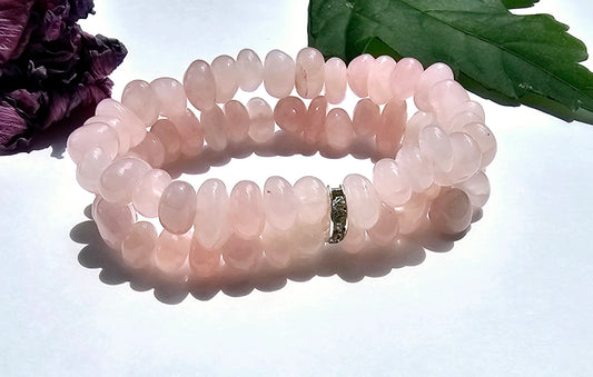 Rose Quartz Bracelet featuring a double-strand design handcrafted with natural rose quartz stones, known as the stone of unconditional love. This healing crystal bracelet promotes emotional balance, self-love, and compassion while adding a delicate, elegant touch to any outfit. Perfect for meditation, mindfulness, or everyday wear, it makes a thoughtful gift for women who appreciate natural stone jewelry, meaningful wellness accessories, heart-centered designs that inspire love.