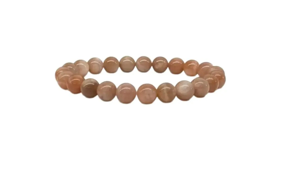 Peach moonstone beaded bracelet handcrafted from natural crystal gemstones known for promoting calm, emotional balance, and intuition. This healing jewelry piece is designed to support mindfulness, meditation, and positive energy, making it a meaningful gift for yoga lovers, spiritual seekers, or anyone drawn to crystal healing. A beautiful everyday accessory that blends boho style with intention, perfect for birthdays, self-care gifts, or personal wellness.