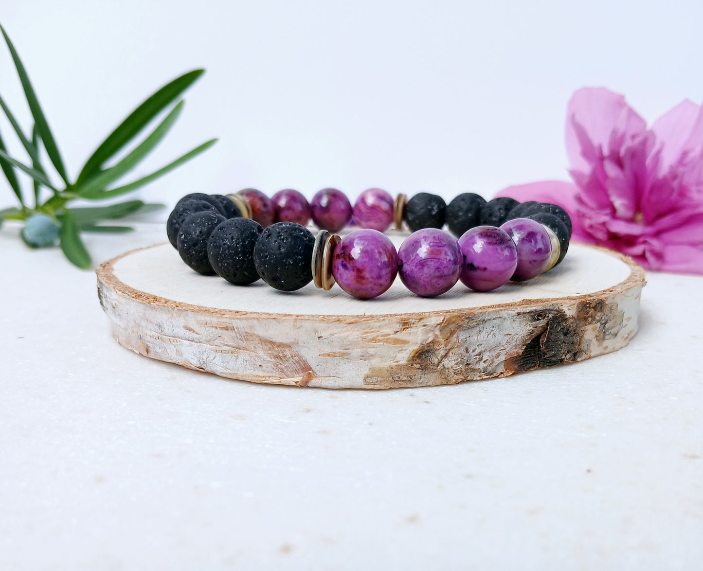 Handmade aromatherapy diffuser bracelet featuring natural purple agate and black lava stones, designed for men and women seeking healing crystal jewelry. This stylish bracelet combines the calming properties of agate with porous lava beads perfect for essential oils, offering both wellness benefits and a fashionable accessory. Ideal as an anniversary gift, this unisex bracelet blends holistic healing with modern handcrafted design.